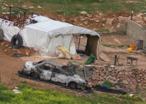 The family’s partially burnt tent and burnt car. Photo courtesy of the family   