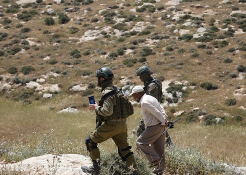 Soldiers taking 87-year-old Muhammad Najjar to the military camp. Photo: Omri Eran Vardi