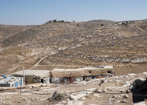 Structures in the community of Khirbet a-Rahwah. The Mor Farm and Avraham Farm outposts are seen in the background. Photo: Omri Eran Vardi