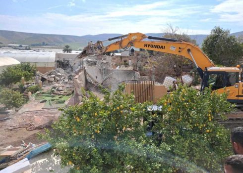 A bulldozer from the Civil Administration demolishes the irrigation reservoirs. Photo: 'Aref Daraghmeh, B'Tselem