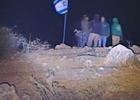 Settlers stand atop the hill from which the stones were thrown. Photo courtesy of local residents