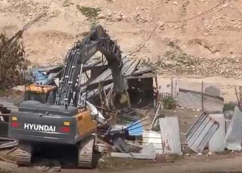 A Civil Administration bulldozer demolishing structures in the community. Photo: ‘Aref Daraghmeh, B’Tselem, 18 Mar. 2025