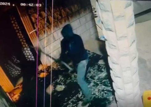 A settler attacking one of the brothers with a club. Still from security camera footage