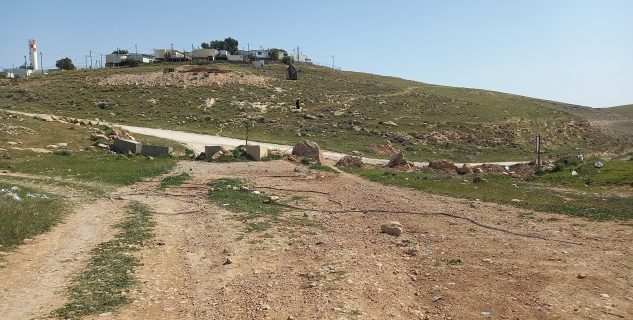 The blocked path to al-Muntar. On the hill is the settlement outpost Havat Tzon Kedar, established in 2019. Photo: ‘Amer ‘Aruri, B’Tselem, 6 March 2024 