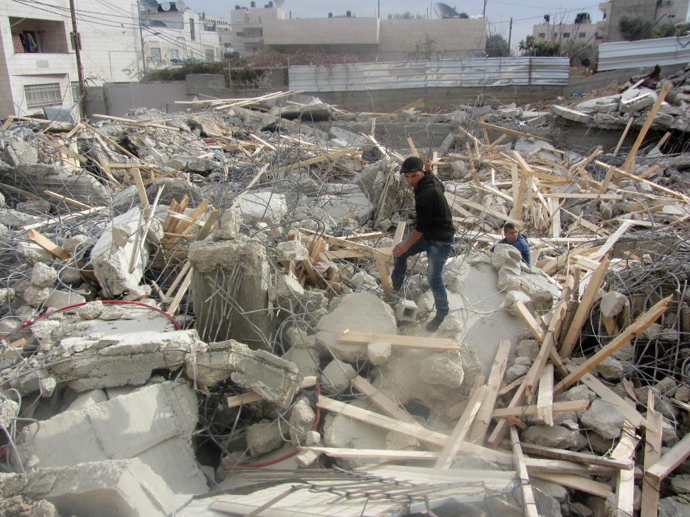 Ruins of 2-story home owned by Muhammad Dari in al-'Esawiyah, demolished before construction was completed. The building was meant to house two families: Muhammad Dari’s and that of his brother ‘Abd al-Hai. The two families currently live in al-'Esawiyah in highly crowded conditions.