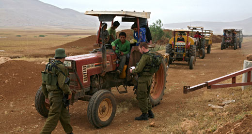 Soldiers detain farmers on dirt road leading to the towns Tammun and Tubas, west of the Jordan Valley. Photo: Keren Manor, activestillos.org, 28 April 2011