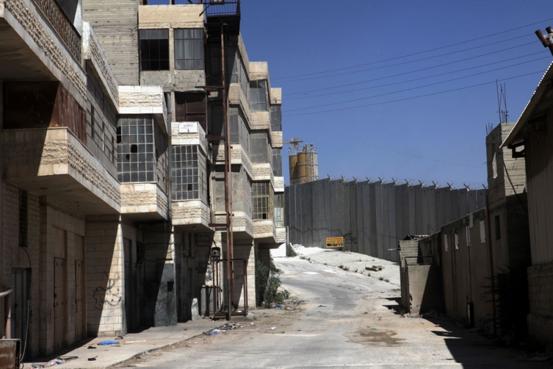 Abandoned buildings located near the Separation Barrier in the town of Bir Nabala, 24 September 2012. Photo: Anne Paq, activestills.org.  Abandoned buildings located near the Separation Barrier in the town of Bir Nabala, 24 September 2012. Photo: Anne Paq, activestills.org.