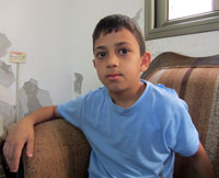Malek Shteiwi, age 9. Photo: 'Abd al-Karim Sa'adi, 17.11.13