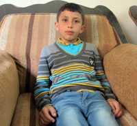 Tareq Shteiwi, age 9. Photo: 'Abd al-Karim Sa'adi, 17.11.13