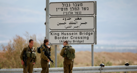 Soldiers near the entrance to Allenby Bridge Crossing. Photo by Ronen Zvulun, Reuters, 10 March 2014