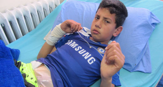 Muhammad Hamad, 11, in hospital in Ramallah. Photo by Iyad Hadad, B’Tselem, 19 March 2015