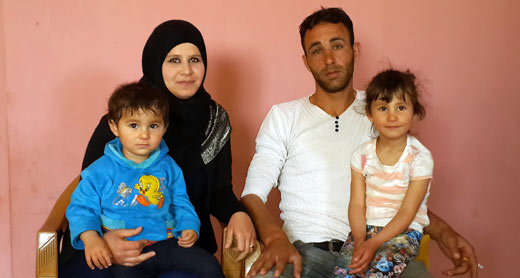 Maha Qawariq, her husband and two of their daughters. Photo: Salma a-Deb’i, B'Tselem, 26 April 2015