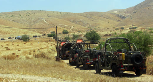 Military vehicles in the Jordan Valley during training. Photo: 'Aref Daraghmeh, B'Tselem, 4 May 2015