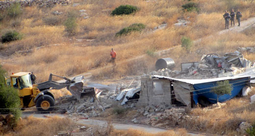 Civil Administration bulldozer razing structure in al-‘Aqabah. Photo: ‘Aref Daraghmeh, B’Tselem, 5 August 2015