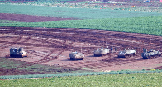  Military tanks in fields cultivated by the community. Photo by ‘Aref Daraghmeh, B'Tselem, 27 Jan. 2016