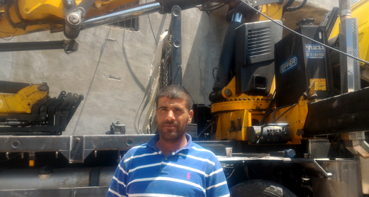 Sarhan Hamed by one of his trucks. Photo by Iyad Hadad, B’Tselem, 3 May 2017 Sarhan Hamed by one of his trucks. Photo by Iyad Hadad, B’Tselem, 3 May 2017