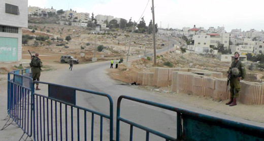 Main street of Wadi a-Nasara, reserved exclusively for settlers. On right: the barrier fencing off the overgrown, stony field designated for Palestinian pedestrians. Photo by Manal al-Ja’bri, B’Tselem, June 2017 Main street of Wadi a-Nasara, reserved exclusively for settlers. On right: the barrier fencing off the overgrown, stony field designated for Palestinian pedestrians. Photo by Manal al-Ja’bri, B’Tselem, June 2017