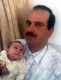 איאד חאמד ובתו התינוקת. התמונה באדיבות המשפחה